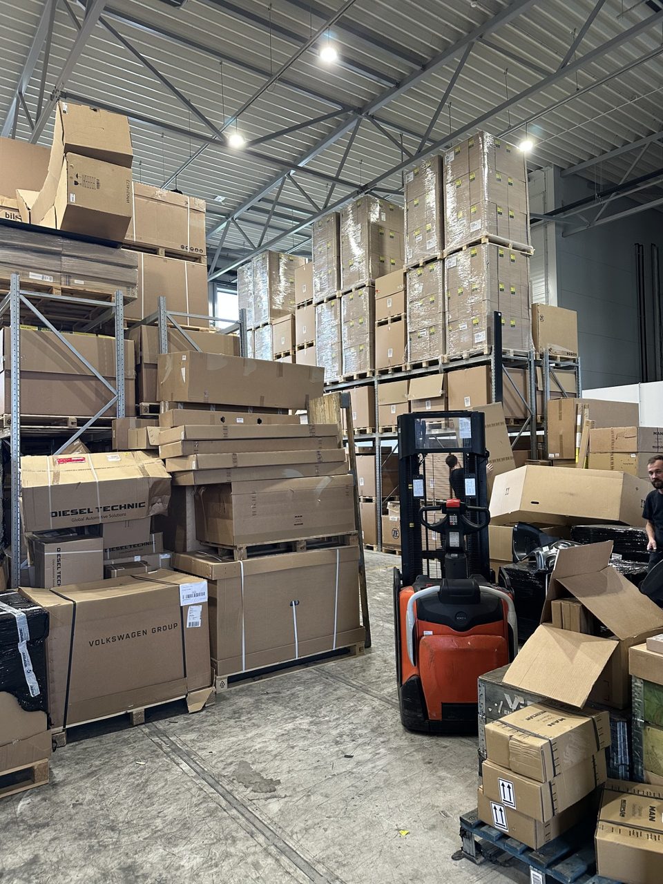 Genuine MAN and NEOPLAN parts boxed on pallets at the Boat For Work warehouse